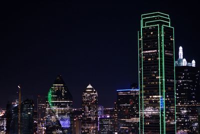 Illuminated buildings in city at night