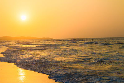 Scenic view of sea at sunset