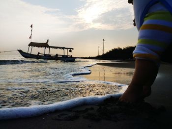 Scenic view of beach against sky during sunset