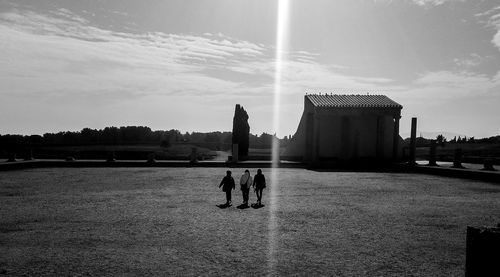 Silhouette of woman against clear sky at sunset