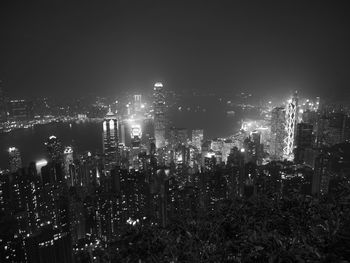 High angle view of illuminated city buildings at night