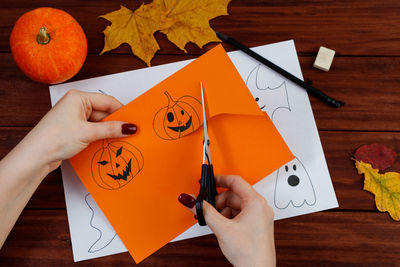 Cropped hands of woman holding envelope