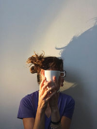Portrait of person drinking coffee