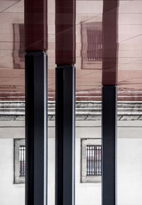Reflection of building on glass window