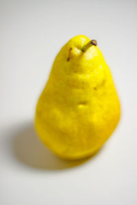 Close-up of lemon against white background