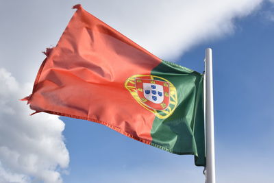 Low angle view of portugal flag against sky