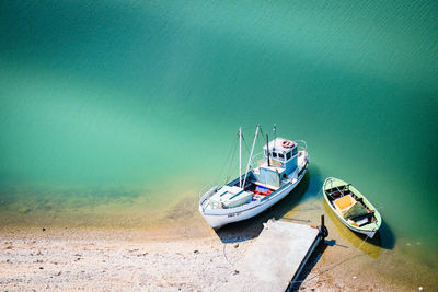 High angle view of ship moored on sea shore