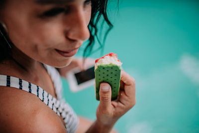 Portrait of woman holding ice cream