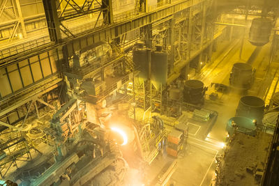 Low angle view of illuminated factory