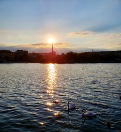 Scenic view of lake against sky during sunset