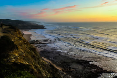 Scenic view of sea against sky during sunset