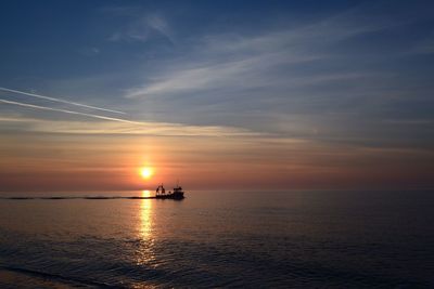 Scenic view of sea at sunset