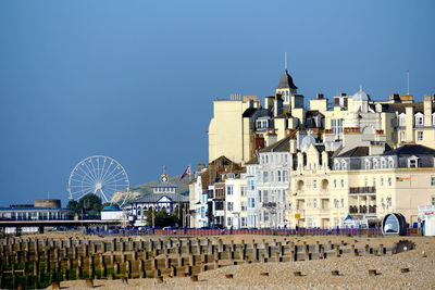 Eastbourne, u.k. hotels on the promenade. sunny day with the pier and ferris wheel in the background