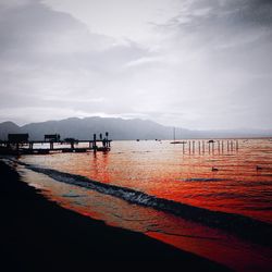 Scenic view of sea against cloudy sky