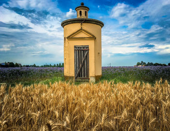 Low angle view of farm against sky