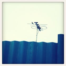 Close-up of wind turbine against clear sky