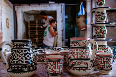 Close-up of ceramics for sale at market stall