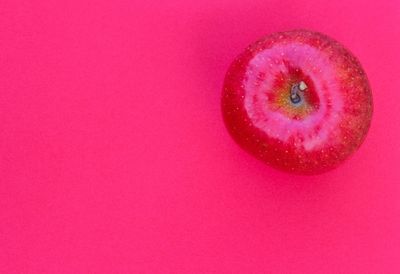 Close-up of red object over white background