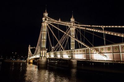 Bridge over river at night