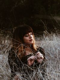 Close-up of young woman in grass