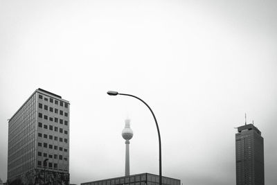 Low angle view of buildings in city against sky