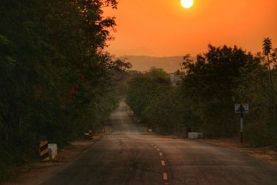 Empty road at sunset