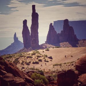 Scenic view of sea and mountains against sky