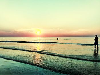 Scenic view of sea against clear sky during sunset