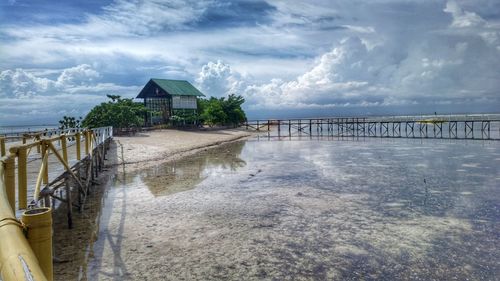 House by sea against sky