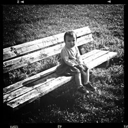 Cute girl sitting on bench