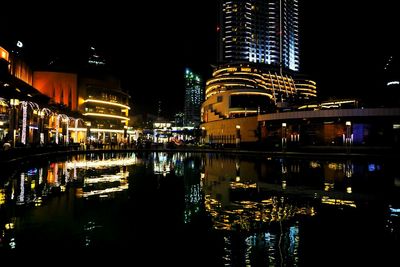 Reflection of illuminated buildings in water