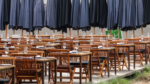 Empty chairs and tables in restaurant