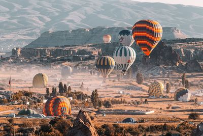 View of hot air balloons on landscape