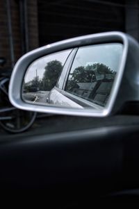 Reflection of car on side-view mirror