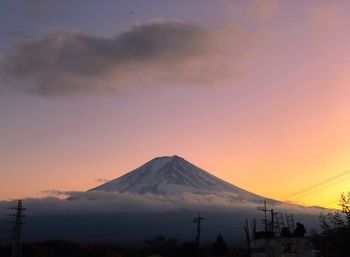 Scenic view of silhouette mountains against sky during sunset