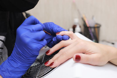 Midsection of doctor examining patient at clinic