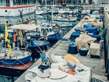 High angle view of boats moored at harbor