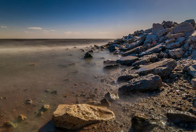 Scenic view of sea against sky during sunset