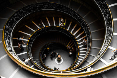 High angle view of people on spiral staircase