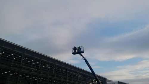 Low angle view of building against cloudy sky