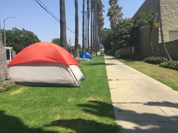 Tent in park on sunny day