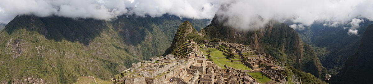 Panoramic view of landscape against cloudy sky