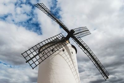 Low angle view of windmill against sky