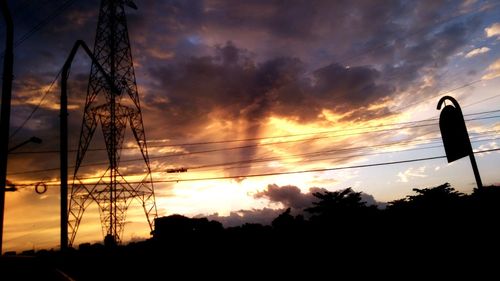 Low angle view of silhouette trees against sky during sunset