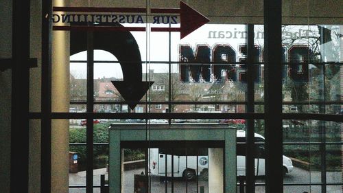 Text on window against sky