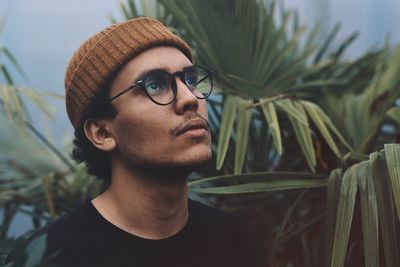 Portrait of young man looking away