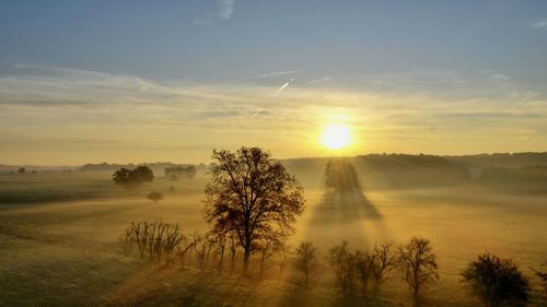 Scenic view of landscape against sky during sunset