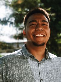 Close-up portrait of smiling young man