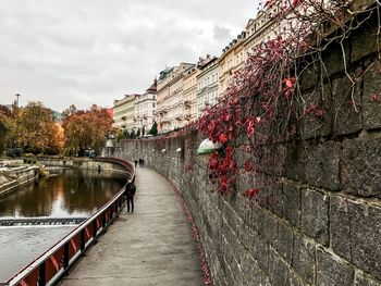 Bridge over canal against sky
