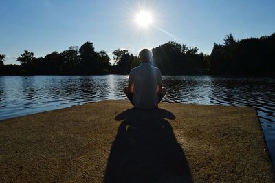 Sun shining over lake